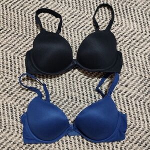 Black and navy Victoria's Secret push up bras